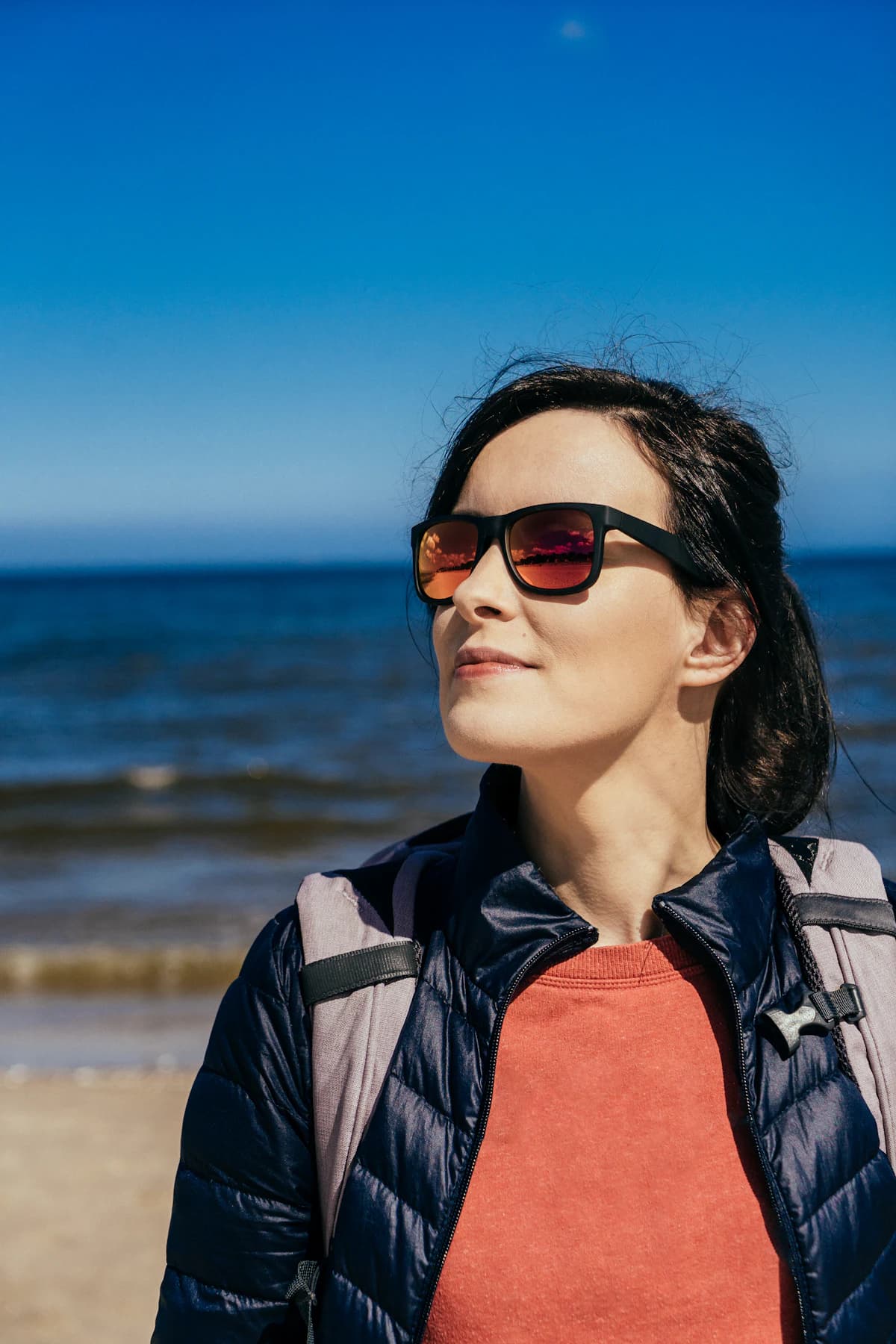 Polarized sunglasses against ocean light evoking Maui Jim Hawaiian polarized lens technology