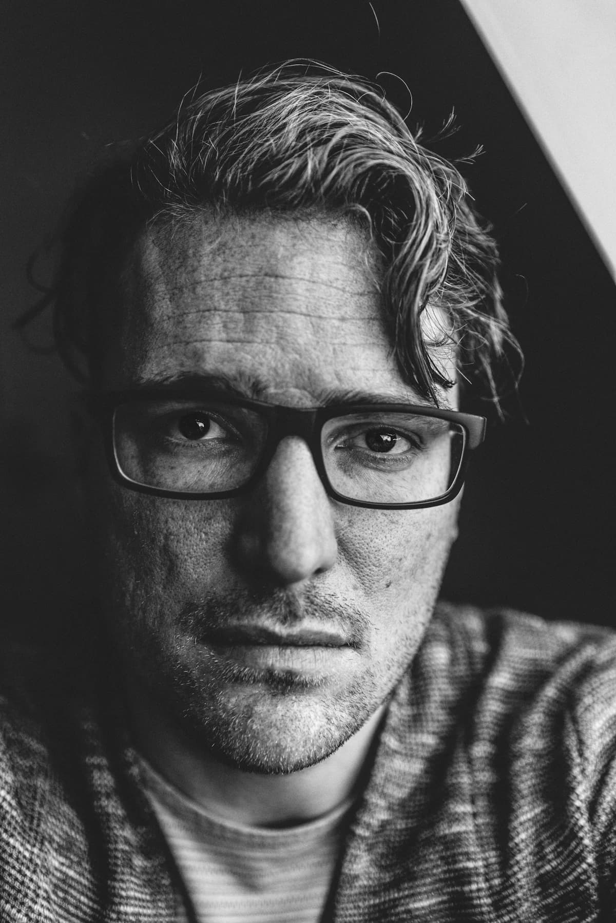 Square eyeglasses portrait illustrating the playbook for choosing square frames for round faces