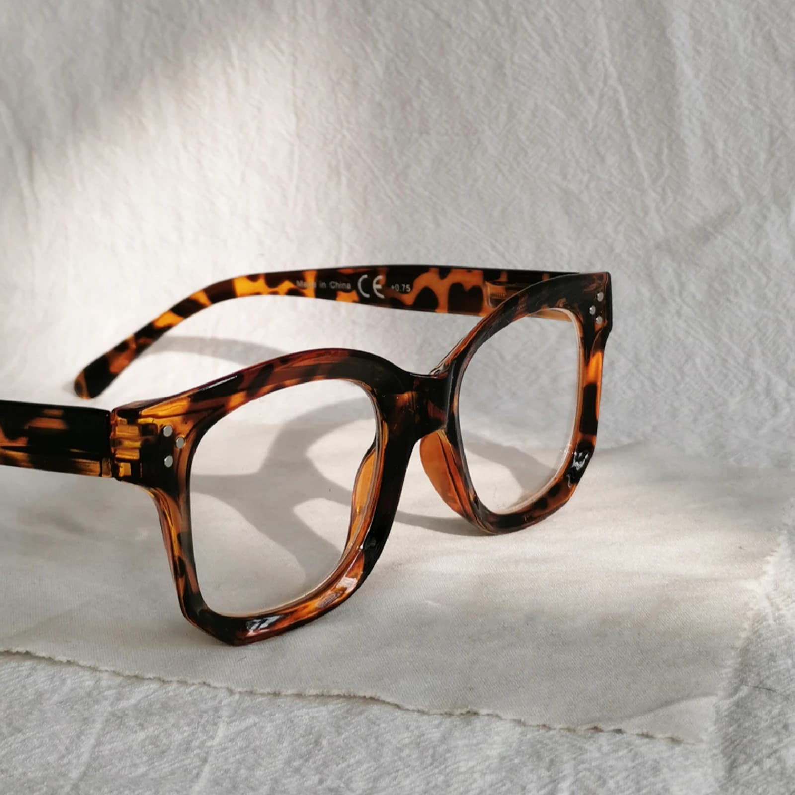 Tortoise acetate frames laid out illustrating the best tortoise acetate eyewear for cool-tone skin